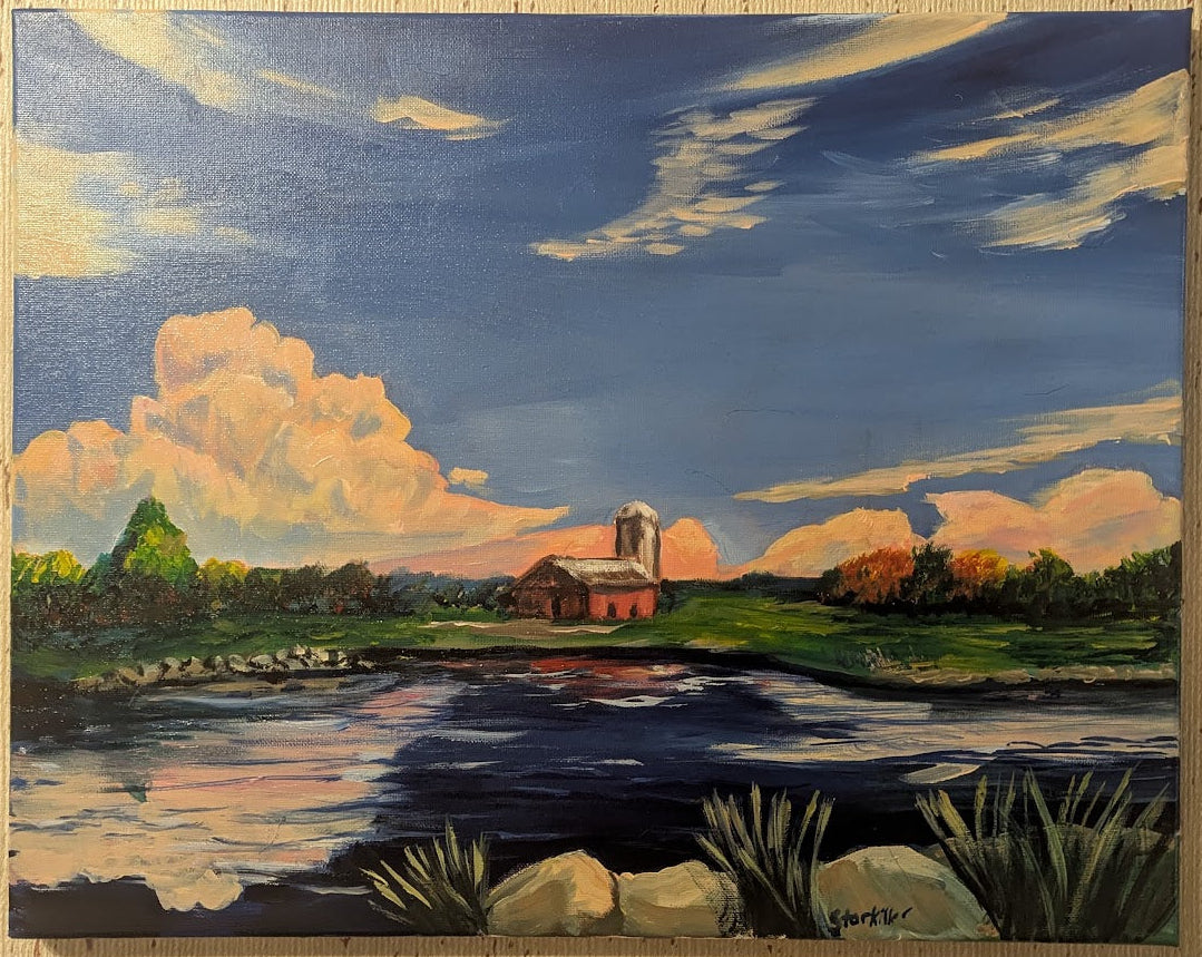 Painting of a landscape with a church, lake, and clouds on a wooden wall.